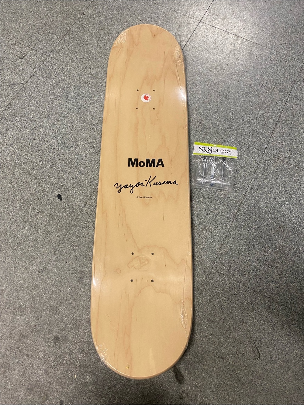 Moma Natural Wood Skateboard Deck with Black Logo and Script